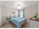 Bedroom with a ceiling fan, window, and neutral walls at 5094 Se 89Th St, Ocala, FL 34480