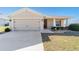 Inviting single-story home with a two-car garage and manicured landscaping at 5094 Se 89Th St, Ocala, FL 34480