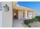 Inviting front porch featuring a decorative door and column at 5094 Se 89Th St, Ocala, FL 34480