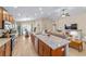 Kitchen featuring stainless steel appliances, wood cabinetry, and center island at 5094 Se 89Th St, Ocala, FL 34480