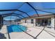 Backyard view showing a pool with a screened enclosure attached to the home at 5094 Se 89Th St, Ocala, FL 34480