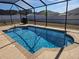 Sparkling pool with clear blue water enclosed by a black screen fence at 5094 Se 89Th St, Ocala, FL 34480