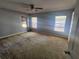 Bright bedroom featuring natural light, three windows and neutral wall paint at 5155 Sw 39Th St, Ocala, FL 34474