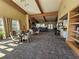 Bright clubhouse featuring a fireplace, a reading nook, and dining and kitchen area at 5155 Sw 39Th St, Ocala, FL 34474