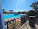 A full view of the community pool on a sunny day with blue skies in the background at 5155 Sw 39Th St, Ocala, FL 34474