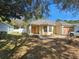 Charming home featuring a bay window, neutral stucco, landscaping, and a one car garage at 5155 Sw 39Th St, Ocala, FL 34474