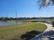 View of the pond and walking path near the community courts on a sunny day at 5155 Sw 39Th St, Ocala, FL 34474