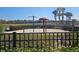 Community splash pad with mushroom sprinkler and a view of palm trees at 5155 Sw 39Th St, Ocala, FL 34474