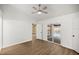 Bright bedroom features wood floors, ceiling fan, and sliding doors to the outdoor pool area at 6 Cherry Drive Ln, Ocala, FL 34472