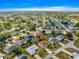 Aerial view of a community shows the positioning of a charming single-story home, mature trees, and beautiful landscape at 6188 Sw 84Th St, Ocala, FL 34476