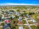 Aerial view of a community shows the positioning of a charming single-story home, mature trees, and beautiful landscape at 6188 Sw 84Th St, Ocala, FL 34476