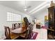 Bright dining room with elegant wood table, seating for six, and lots of natural light at 6188 Sw 84Th St, Ocala, FL 34476