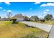 Charming single-story home featuring a well-maintained front lawn and driveway leading to a two-car garage at 6188 Sw 84Th St, Ocala, FL 34476