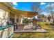 Patio with an awning, lounge chairs, and a small utility box at 6188 Sw 84Th St, Ocala, FL 34476