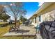 Inviting patio area featuring comfortable seating and a grill, perfect for outdoor entertaining and relaxation at 6188 Sw 84Th St, Ocala, FL 34476