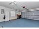 A spacious garage with epoxy flooring providing ample space for parking and storage at 6793 Sw 111Th Loop, Ocala, FL 34476