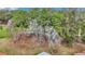 A partial rooftop view revealing the lush green trees and natural landscape surrounding the property at 6793 Sw 111Th Loop, Ocala, FL 34476