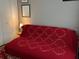 Bedroom with a futon featuring an ornate quilt pattern at 8045 Sw 115Th Loop, Ocala, FL 34481