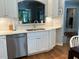 Kitchen area featuring white cabinets, stainless steel appliances, and hardwood floors at 8045 Sw 115Th Loop, Ocala, FL 34481