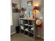 Living space with a gray shelf, lamps, and decorative items for cozy living at 8045 Sw 115Th Loop, Ocala, FL 34481