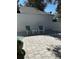 Patio with modern chairs, a stylish table and textured brick flooring at 8045 Sw 115Th Loop, Ocala, FL 34481