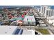 Overhead view of a city skyline, showing proximity of a parking structure to a water park and beachfront at 840 Center Ave # 98, Holly Hill, FL 32117