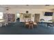 A clubhouse featuring a library, kitchenette, seating area, and a TV for relaxation at 840 Center Ave # 98, Holly Hill, FL 32117