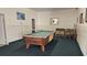 The game room contains a pool table, carpeted floors, and a cozy atmosphere for entertainment at 840 Center Ave # 98, Holly Hill, FL 32117