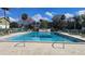 Community pool with lounge chairs and clear blue water, great for relaxing and enjoying the sunshine at 840 Center Ave # 98, Holly Hill, FL 32117