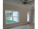 Bright living room featuring a large window and tile floors at 8498 Sw 129Th Terrace Rd, Dunnellon, FL 34431