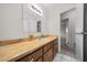 Bathroom featuring a long vanity with a white sink and views to the hallway and other rooms at 8973 Sw 104Th Ln, Ocala, FL 34481