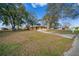 Quaint single story home with covered parking and a long concrete driveway at 8973 Sw 104Th Ln, Ocala, FL 34481