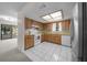 Cozy kitchen featuring light cabinets and a window over the sink at 8973 Sw 104Th Ln, Ocala, FL 34481