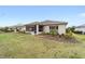 Cozy single-story home with a screened-in patio and a lush, green lawn perfect for outdoor relaxation at 9276 Sw 89Th St Rd, Ocala, FL 34481