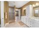 Bathroom featuring double sinks, a shower, and tile flooring at 9276 Sw 89Th St Rd, Ocala, FL 34481