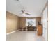 Bright, spacious bedroom with tile floors, ceiling fan, and natural light from a large window at 9276 Sw 89Th St Rd, Ocala, FL 34481