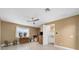 Bedroom with tile floors, ceiling fan, and a view of the connected bathroom and closet at 9276 Sw 89Th St Rd, Ocala, FL 34481