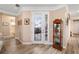 Inviting foyer with decorative cabinet, glass door, and elegant decor, with views to the outside patio at 9276 Sw 89Th St Rd, Ocala, FL 34481