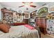 Bedroom filled with collectables, featuring bed and vintage furniture at 9285 Sw 90Th St, Ocala, FL 34481