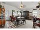 Cozy dining area with a glass-top table and unique decor, offering a comfortable space for meals at 9285 Sw 90Th St, Ocala, FL 34481