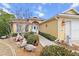 Attractive home showcasing walkway to front door, decorative features, and two-car garage at 9285 Sw 90Th St, Ocala, FL 34481