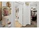 Hallway featuring a decorative water cooler and open bathroom doorway at 9285 Sw 90Th St, Ocala, FL 34481