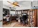 Home office with built-in shelving, ceiling fan, and ample workspace at 9285 Sw 90Th St, Ocala, FL 34481