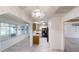 A galley kitchen featuring black appliances, white cabinets, and a breakfast nook with lots of natural light at 9286 Sw 89Th Court Rd # D, Ocala, FL 34481