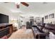 Living room with a view of the kitchen, features dark wood floors and neutral walls at 9691 Sw 95Th Ct # D, Ocala, FL 34481