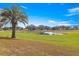 Beautiful backyard featuring a serene view of the golf course pond at 9884 Se 175Th Pl, Summerfield, FL 34491