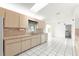 Open kitchen featuring white tile flooring and white appliances ready for culinary adventures at 9884 Se 175Th Pl, Summerfield, FL 34491