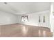 Bright living room featuring tile floors, ceiling fan and decorative window at 9884 Se 175Th Pl, Summerfield, FL 34491