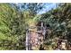 Backyard with a gate made of brick and chain link fence, surrounded by greenery at 10958 Sw 86Th Ct, Ocala, FL 34481