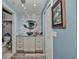 Bathroom featuring modern vanity with granite countertop, a vessel sink, and decorative mirror and wall tiles at 10958 Sw 86Th Ct, Ocala, FL 34481
